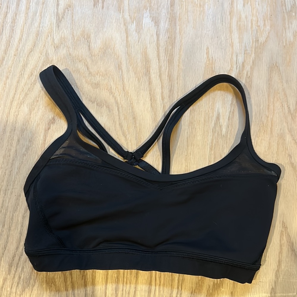 Black lululemon bra with mesh detail on bra top. Size 4